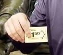 person holding a card saying 1:50