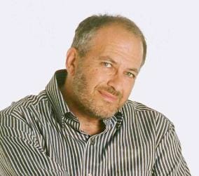 Photo of David Strom in a striped shirt, smiling at the camera