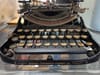 Photograph of an antique Corona portable typewriter